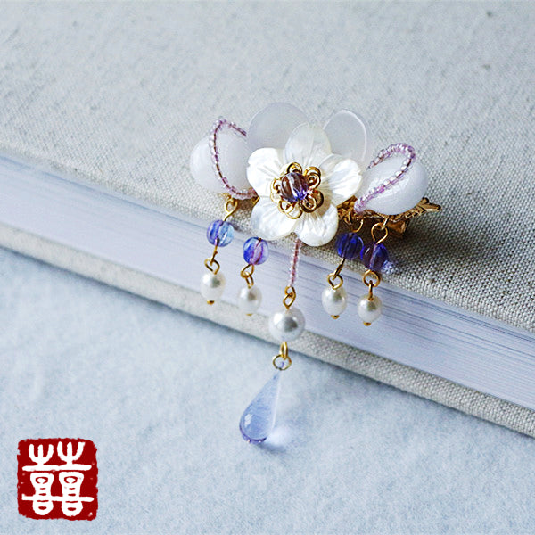 this hair clip features a big sakura flower made of seashell