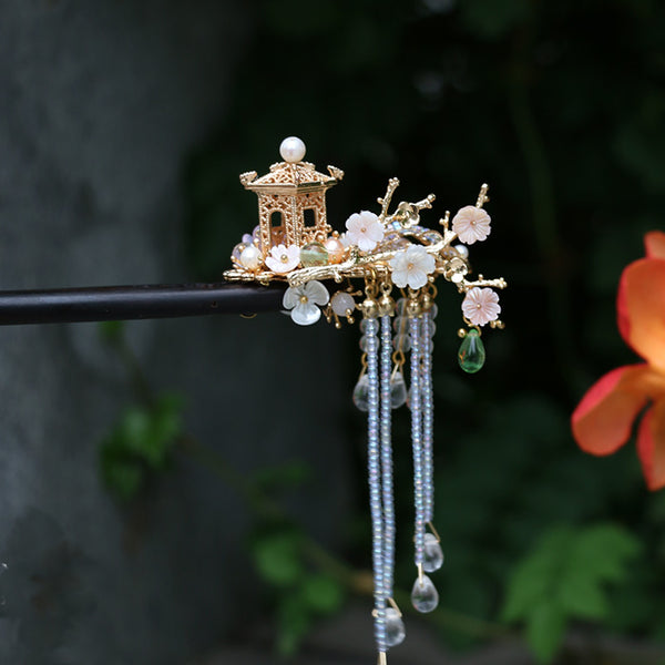 This hair stick is unique, made of precious sandalwood, and decorated with Oriental culture symbols