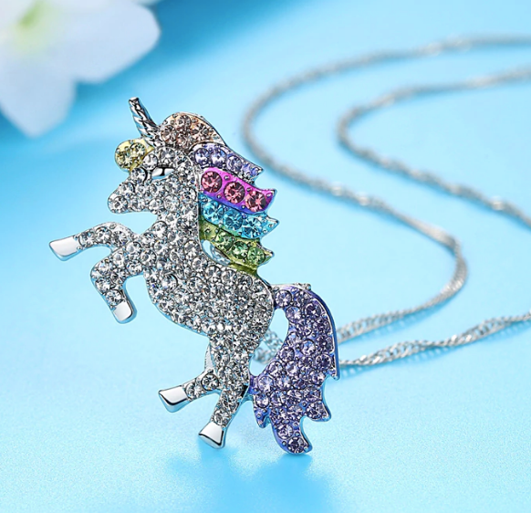 Unicorn Rainbow necklace on blue background