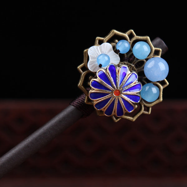 close up on the blue agate and enamel cloisonne flower