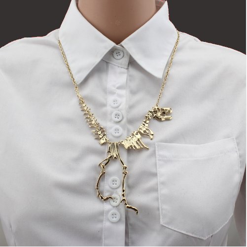 Model wearing T-rex dinosaur skeleton necklace