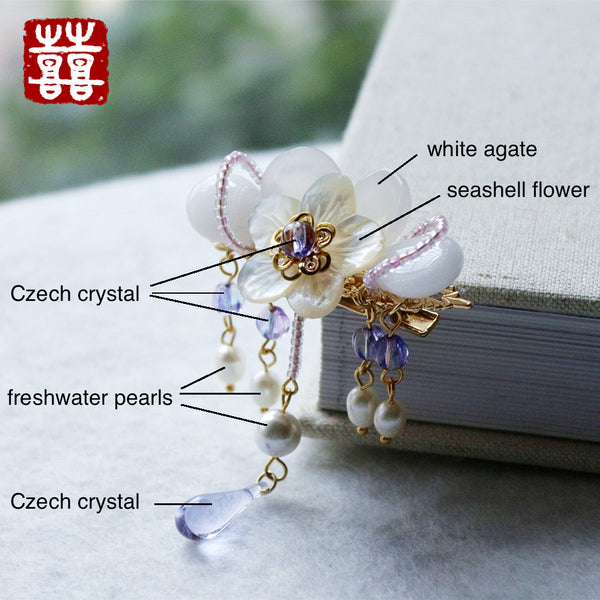 This hair accessories is made of white agate, seashell, crystal, freshwater pearls and quality alloy.