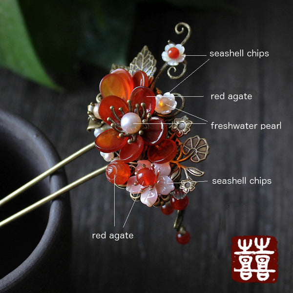 details: this hair stick is decorated with red agate, seashell and freshwater pearls