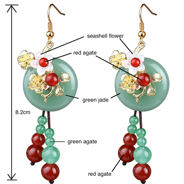 the earrings are made of green jade, red agate beads and seashell