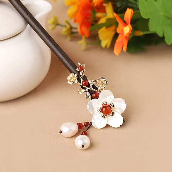 tassels made of freshwater pearls and flower made of seashell and agate beads