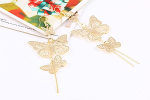 The Dancers -- Long Butterfly Dangle Earrings in gold