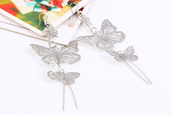 The Dancers -- Long Butterfly Dangle Earrings in silver