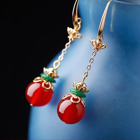 Asian earrings design, with red agate and green jade decorations