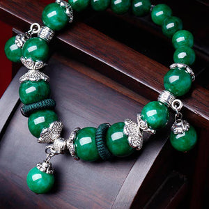 Charm bracelet for women, with green jade beads and Tibetan silver decorations