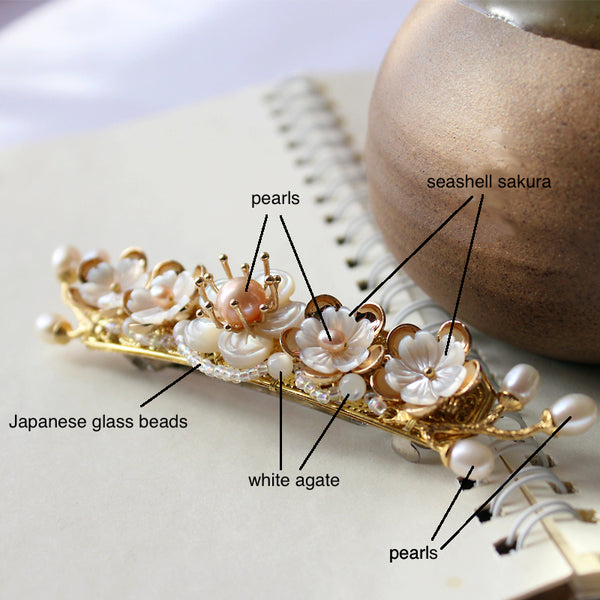 the hair barrette is made of agate, freshwater pearls, seashell and quality alloy metal parts