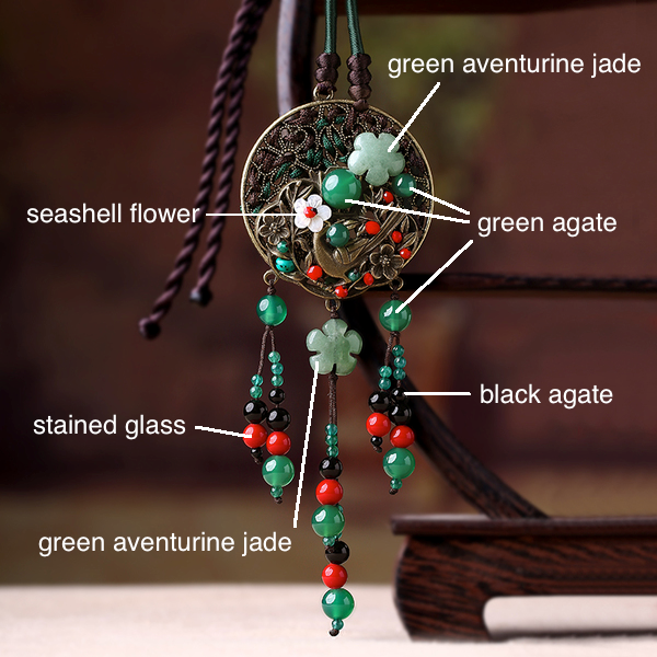 details. the pendant is made with seashell, stained glass, jade, agate and quality metal parts.