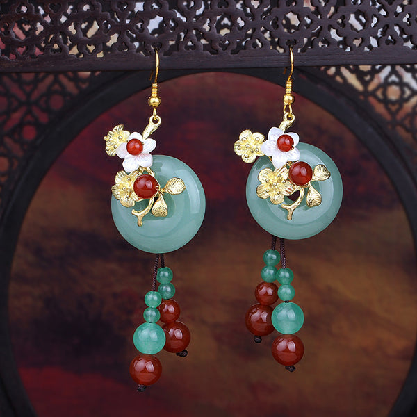 jade and flower dangle earrings with tassels