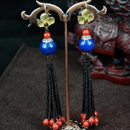 Asian earrings with large blue stone beads, and long black agate bead tassels