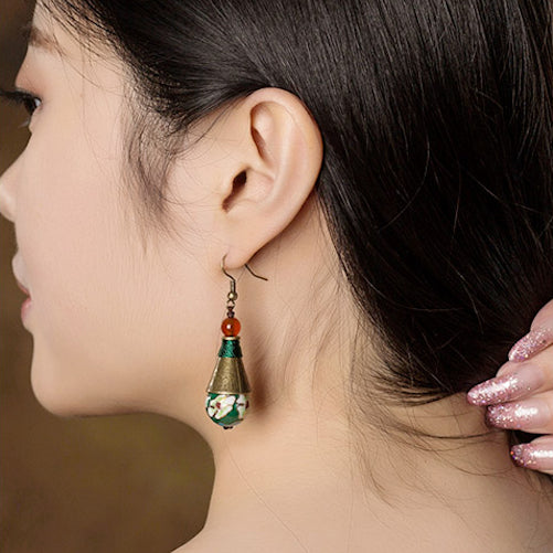 model wearing the earrings, side view