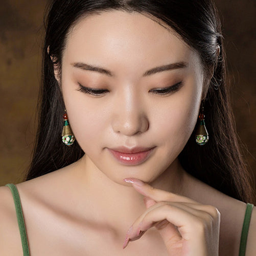 model wearing the earrings, front view